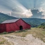 A barn in a mountain valley